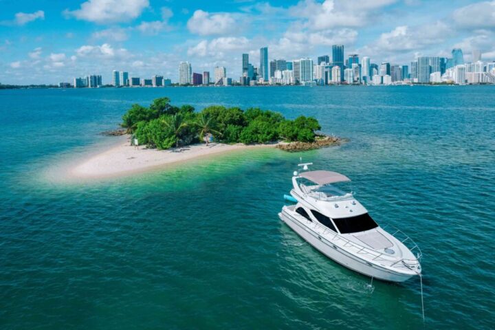 Aerial of a sandbar island in Biscayne Bay with the Miami skyline on the horizon