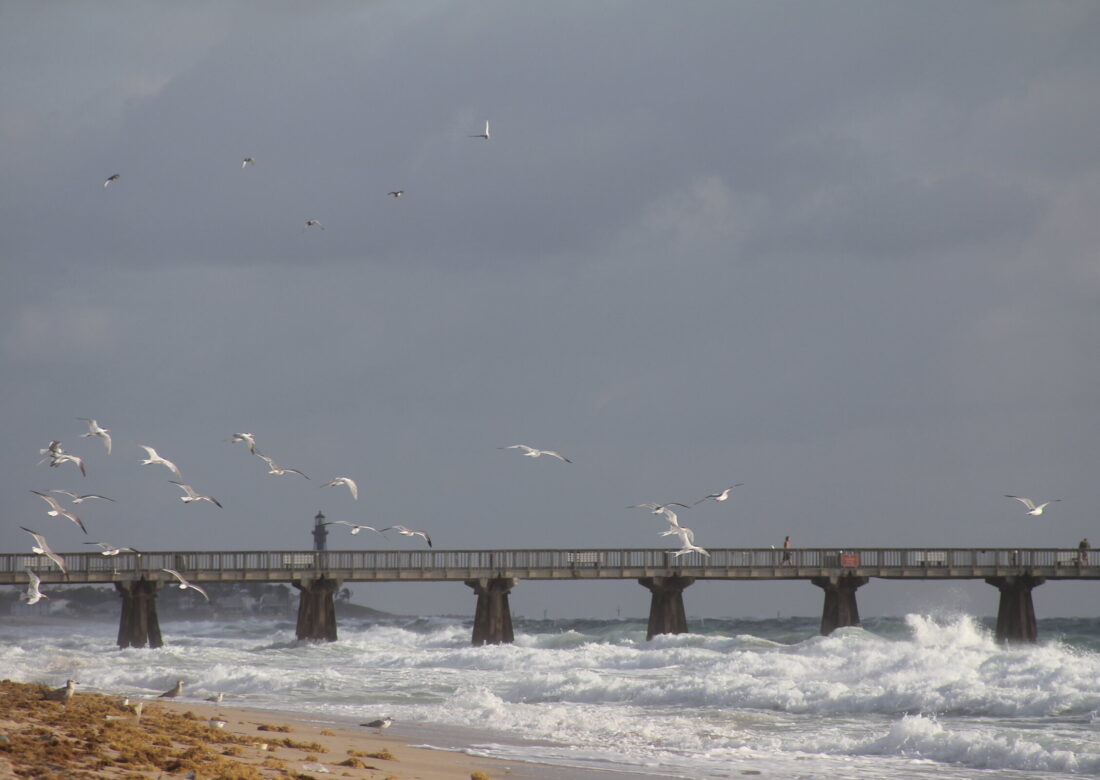 The Pompano Beach fishing pier over the Atlantic surf