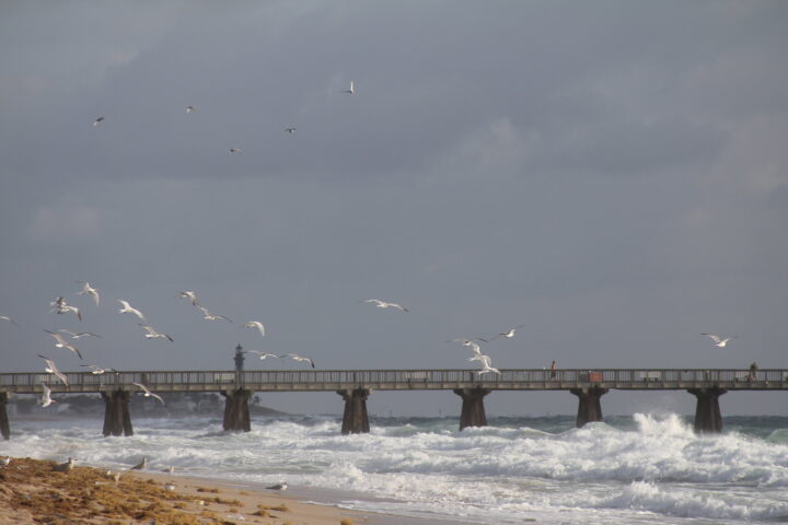 The Pompano Beach fishing pier over the Atlantic surf